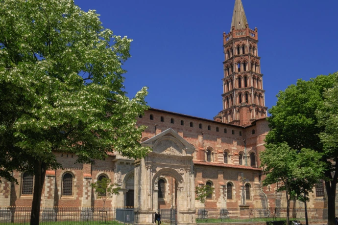 a large building with a tall tower with a clock on it